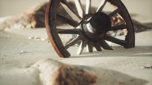 Weathered Wagon Wheel Buried in Desert Sand