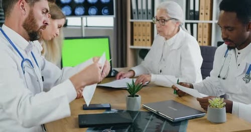Doctors Collaborate in Modern Hospital Office Setting