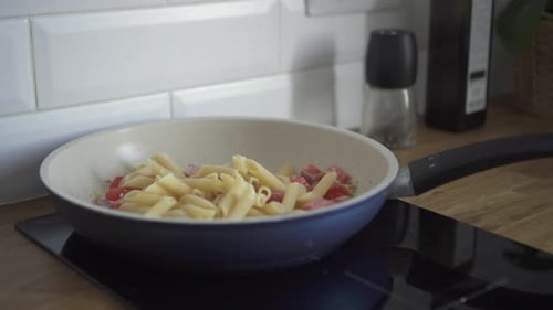 Pasta Cooking with Fresh Tomatoes in Pan