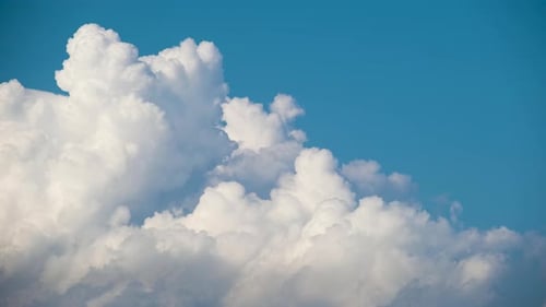 Timelapse of White Puffy Cumulus Clouds Forming on Summer Blue Sky