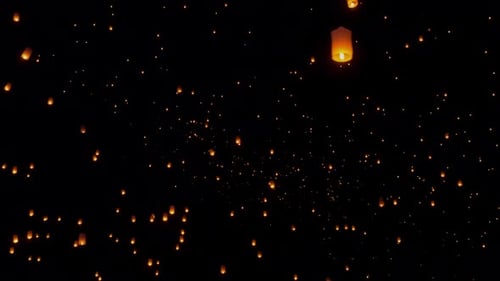 Glowing Sky Lanterns Soar in the Night