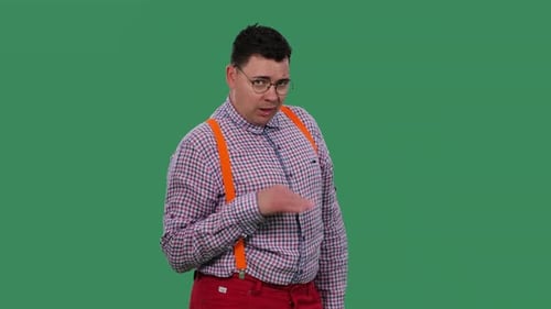 Man Gesturing and Talking Against a Green Screen