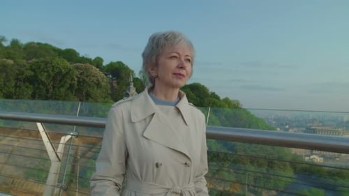 Elegant Woman Walking Outdoors in City Setting