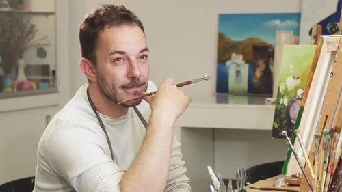 Professional Artist Painter Relaxing at His Studio