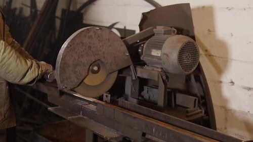 Master Is Cutting Long Metal Detail By Powerful Industrial Circular Saw