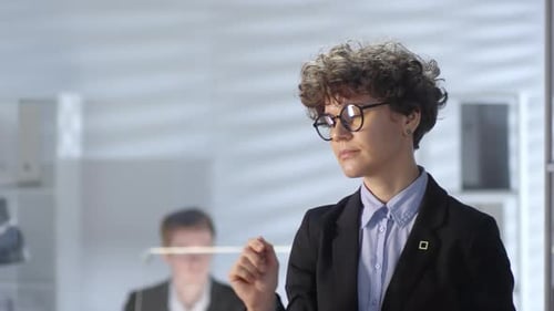 Businesswoman Working on Invisible Touch Interface in Office