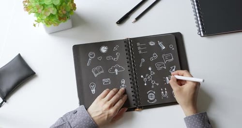 Digital marketing concept. Business woman designer hands draw notes in notebook. 4K.