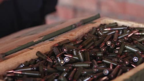 Close Up of Rifle Rounds in a Wooden Box
