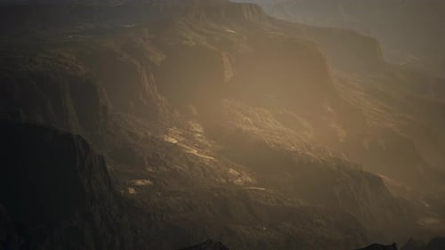 Aerial Flight Over Majestic Desert Canyon Landscape at Golden Hour