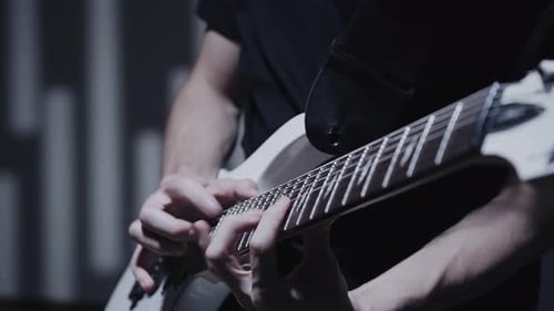 Guitarist`s Hands Playing on Guitar