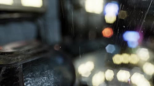 Rain Drops on Window with Urban Bokeh Lights Overlay