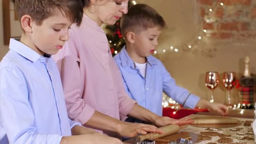 Family Baking Christmas Cookies Together at Home