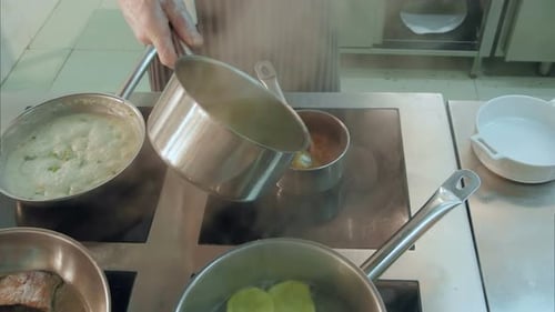 Chef Prepares Food on Stovetop in Commercial Kitchen