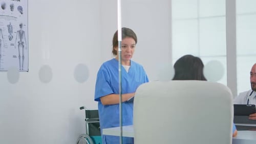 Nurse Discusses Care with Patient and Doctor