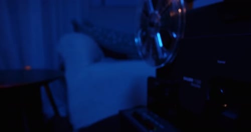 Retro Film Projector in Dark Home Setting