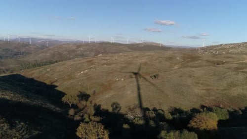 Wind Turbines Shadow, Renewable Energy on a Green Hill