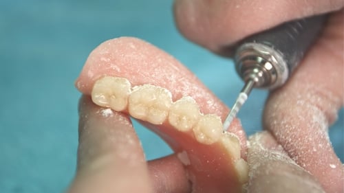 Dental Technician Smoothing False Tooth Edges
