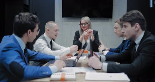 Business Team Meeting in Modern Conference Room