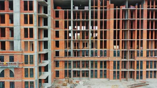 New house in residential complex. Aerial view of construction building at construction site