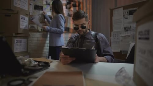 Detectives Working in Gritty Urban Police Office