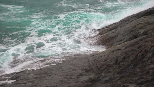 Powerful Waves Beating Against the Rocks. Turquoise Water in The Tropical Sea
