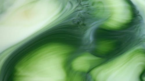 Ink in Water, Green Ink Reacting in Water Creating Abstract Background