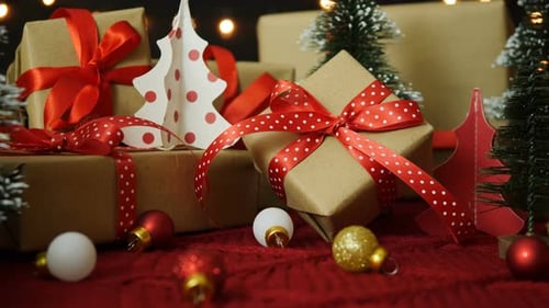 Wrapped Gifts on Red Knitted Surface