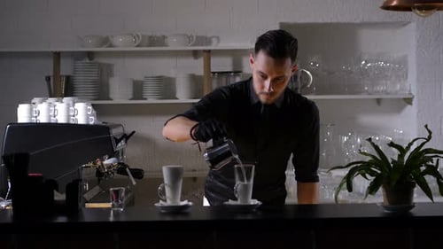 Man Making Latte at Cafe Bar