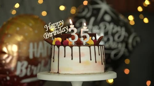 Festive Birthday Cake with Candles and Balloons
