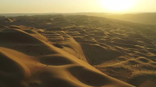 Aerial view of Dubai desert at sunset, United Arab Emirates.