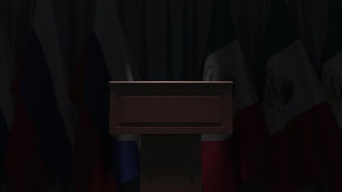 Many Flags of Mexico and Russia Behind Speaker Tribune