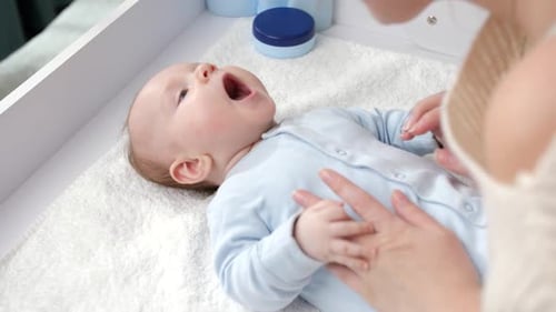 Adorable Baby With Loving Adult at Home