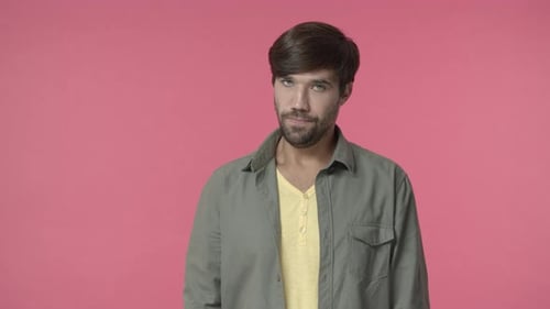 Man Expressive Looking Around With Arms Crossed