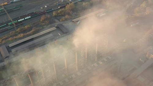 Aerial View. Emission To Atmosphere From Industrial Pipes. Smokestack Pipes Shooted with Drone