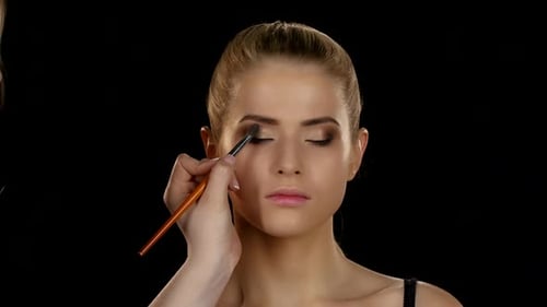 Model Receiving Eye Shadow Application