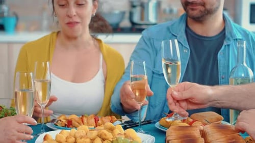 Friends Toast Champagne at Festive Indoor Party