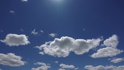 Clouds Moving Across Blue Sky on a Sunny Day