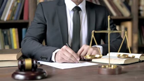 Close Up Shoot of Judge Hand Signing Document in Court Room