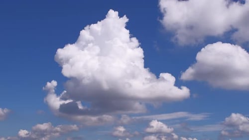 Fluffy cloud time lapse on a cloudy day 4k footage.
