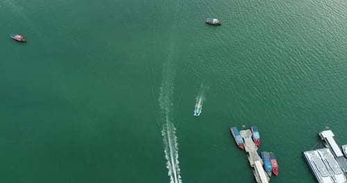 Aerial view of speed boats on the sea near beach city