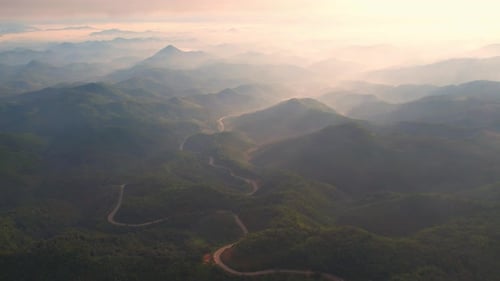4K High mountain road in fog. Tropical forest with smoke and fog.