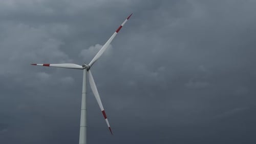 Windmill or Wind Turbine on Wind Farm in Rotation