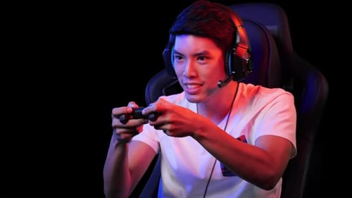 Focused Young Adult Gaming with a Controller