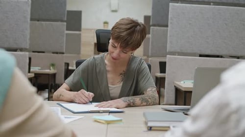 Team Meeting in Modern Office with Handshake