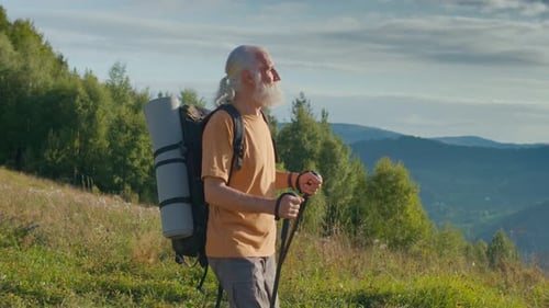 Senior Man Hiking in Rural Mountain Landscape