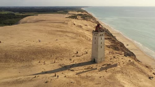 Aerial View of Lighthouse Along Coastal Sand Dunes