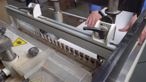 Cutting Wood with Machine at Carpentry Workshop