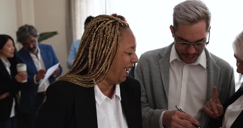 Multiracial business people working inside modern bank office
