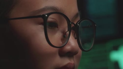 Asian Young Girl Hacker Hacking With Multiple Computer Screens In Dark Room