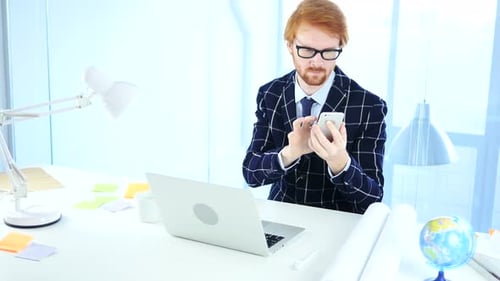 Adult using cell phone in bright modern office